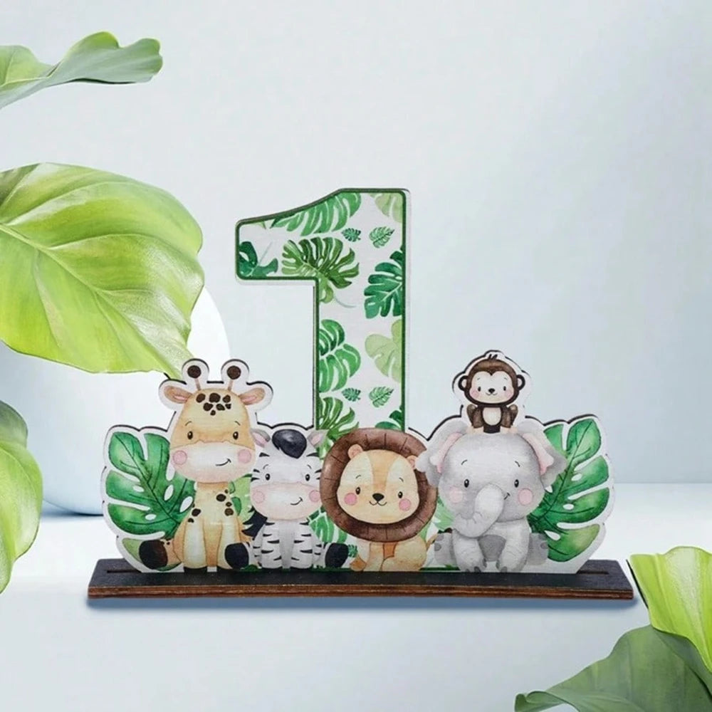 A wooden ornament featuring jungle animals like a giraffe, zebra, lion, and elephant in green and white paint.