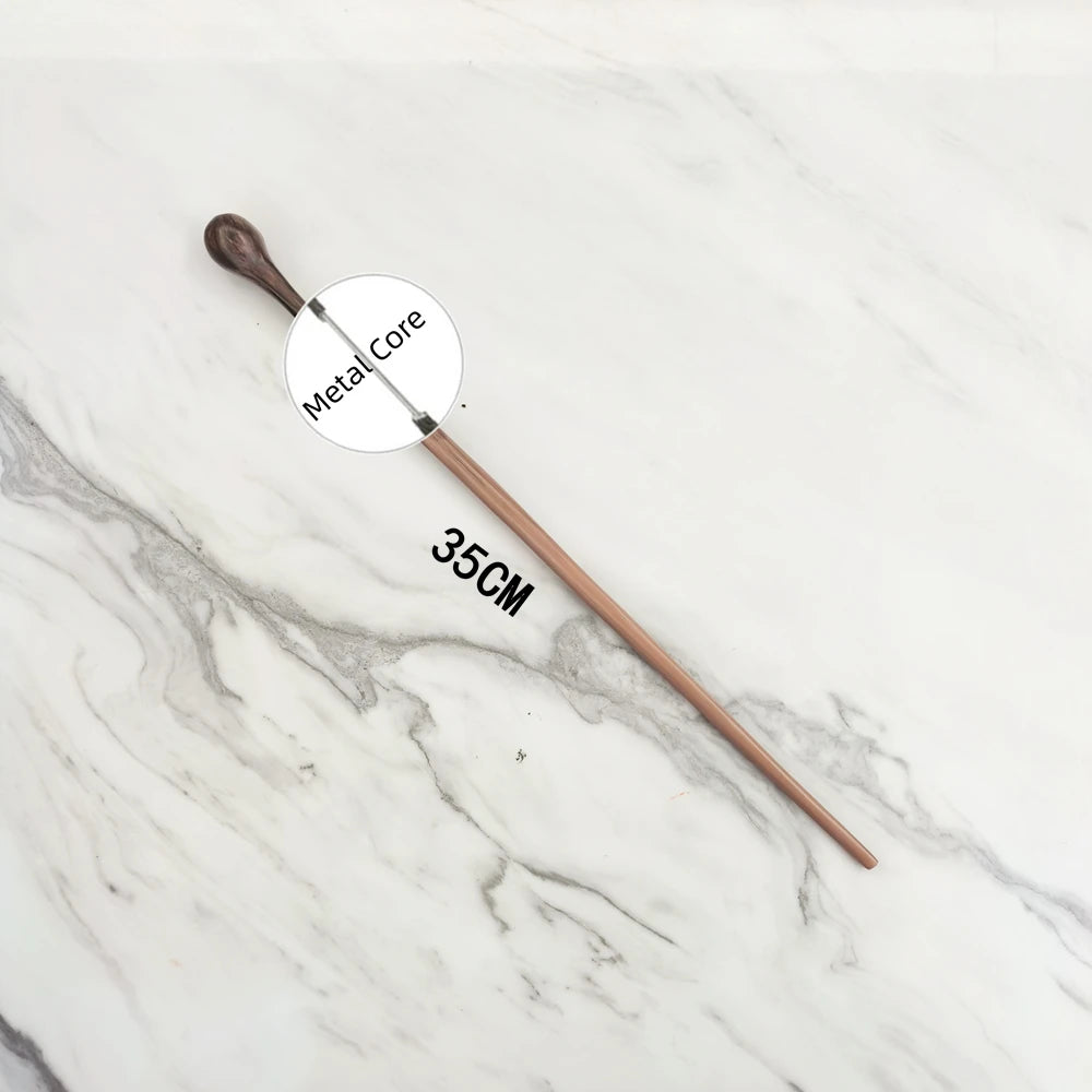 A wooden magic wand replica with a metal core is displayed on a white marble surface.