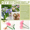 A hand holds a pink flower made from flexible green floral wire stems for DIY arrangements.