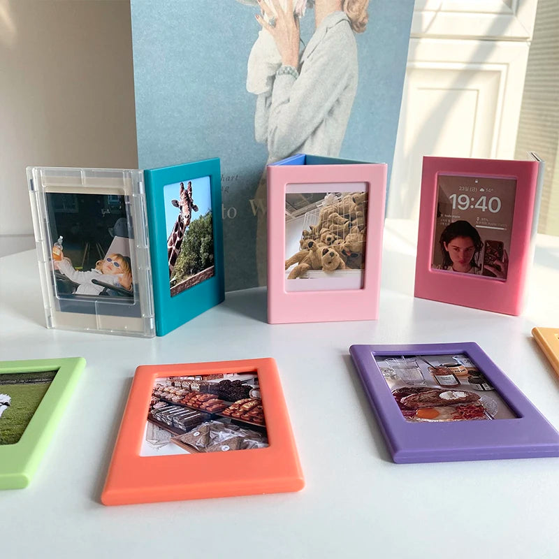 A collection of colorful magnetic photo frames displaying various images and landscapes.