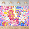 A colorful birthday cake decoration featuring the text I Was Six Now I Am Seven surrounded by confetti and bright colors.