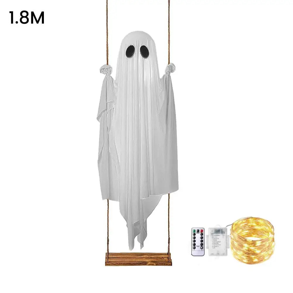 A white ghost decoration is hanging by a string, illuminated by LED string lights.