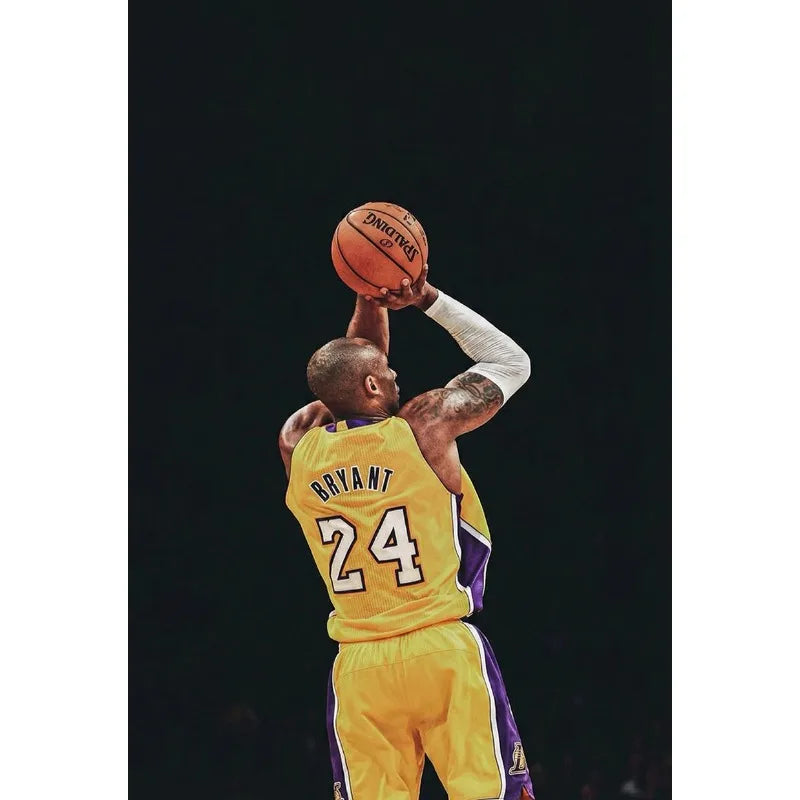 A basketball player in a yellow jersey is shown dunking or preparing to dunk against a dark background.