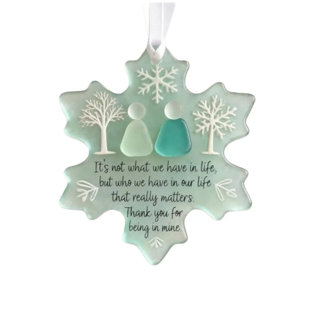 Handcrafted acrylic friendship snowflake Christmas pendant with two figures inside.