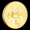 A gold-plated commemorative coin featuring a depiction of Jesus Christ with radiating light.