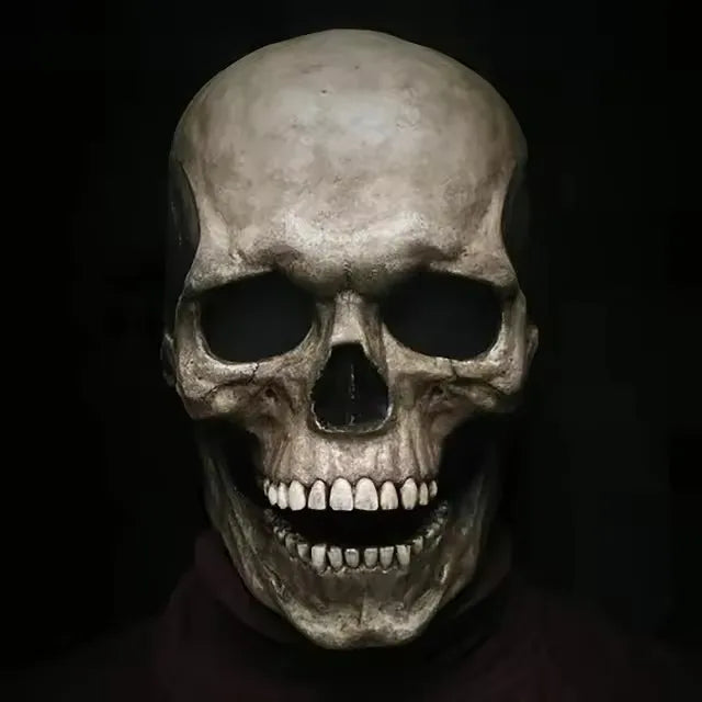 A realistic full-head skull mask with a dark, weathered finish.