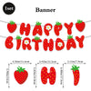 A set of strawberry birthday banner decorations featuring letter toppers and a large strawberry shape.