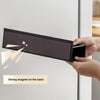 A hand is holding a black magnetic spice rack designed to attach to a refrigerator, showing its design and strong magnet feat