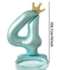 A large, light blue foil number balloon shaped like the number 4 with a gold crown topper.