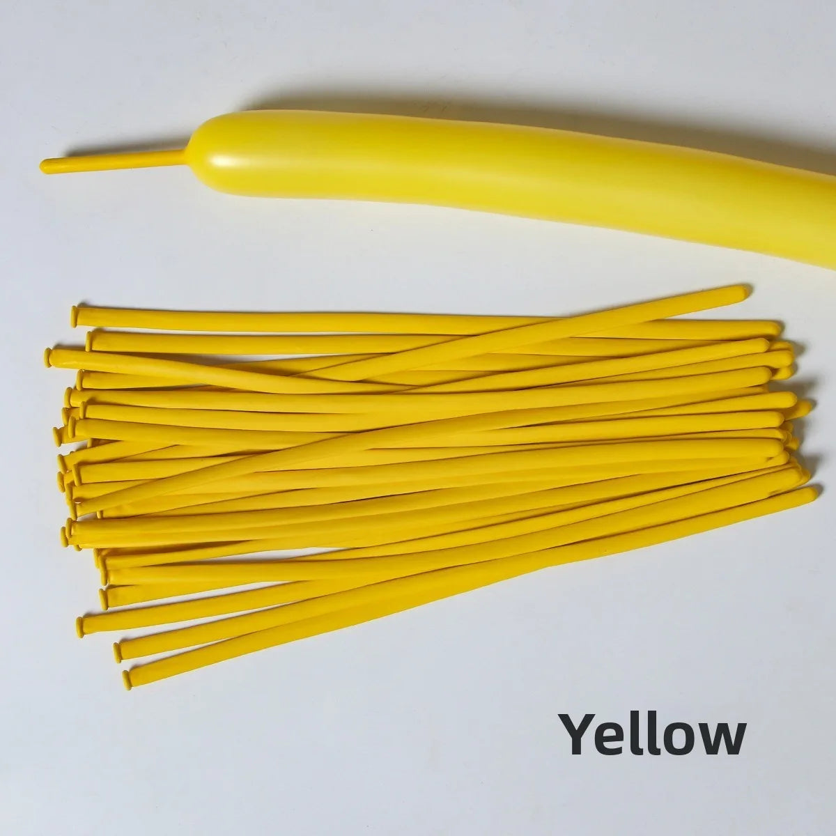 A yellow latex strip balloon and a bundle of yellow balloons on a white background.