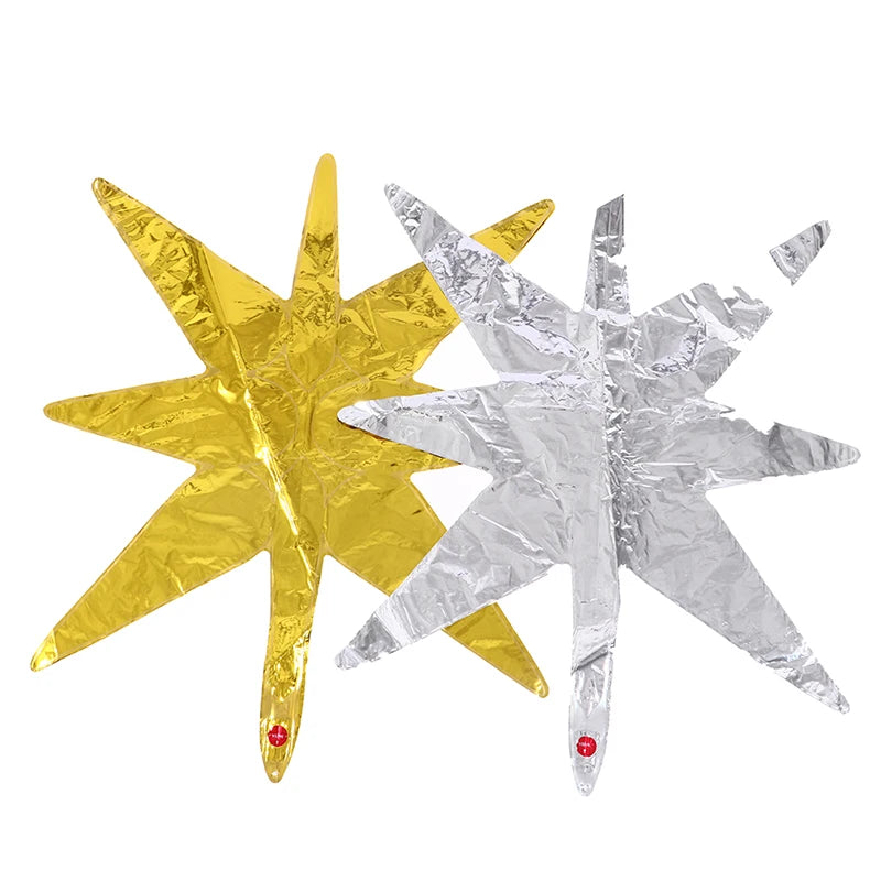 Two foil star burst balloons, one gold and one silver, for party decor.