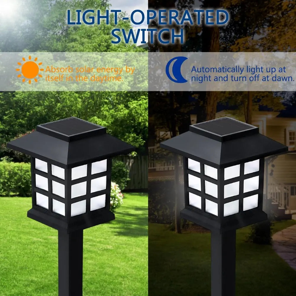 A black light-operated switch outdoor pathway lamp with a solar panel, illuminating a lawn.