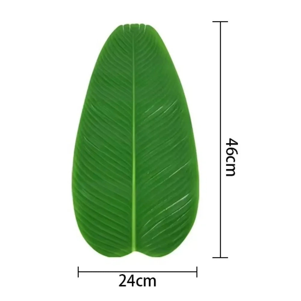 A single vibrant green tropical banana leaf used as a coaster or table protector.