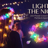 A woman wearing a glowing LED flower crown headband with lights in an outdoor festival setting.