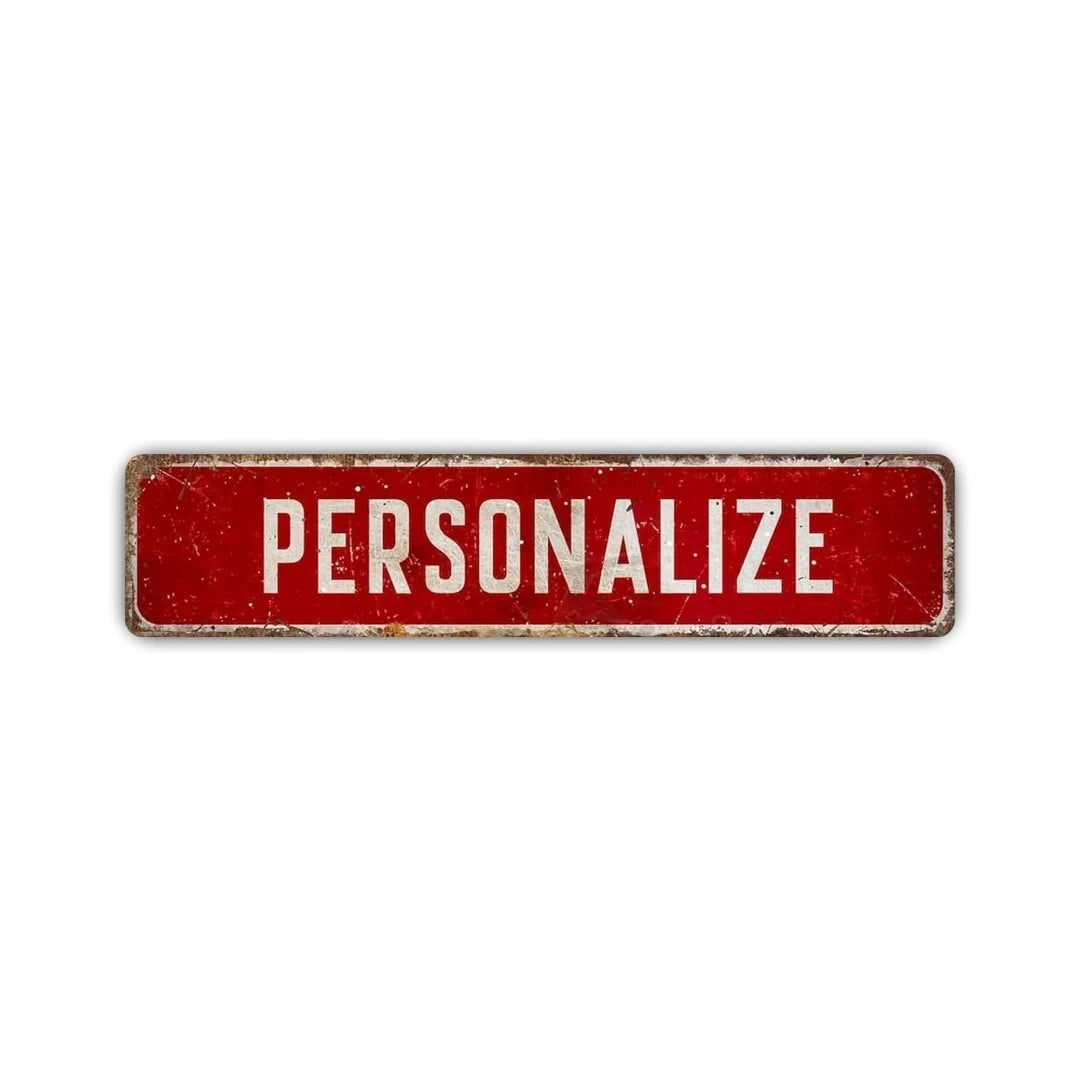 A rectangular red rustic aluminum street sign with the word PERSONALIZE written in white capital letters.