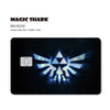 A black card featuring a holographic shark design for a credit card skin.