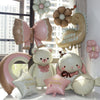 A collection of matte 3D heart love-you bear foil balloons in pink, beige, and white.