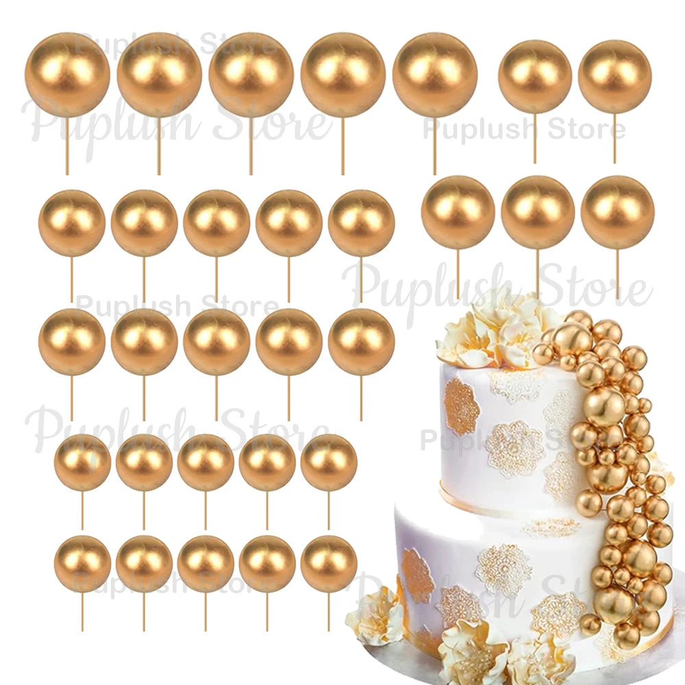 A set of gold and rose gold foam cake toppers, including various sized round discs.