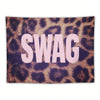 Tapestry with leopard print background and the word SWAG in light pink text.