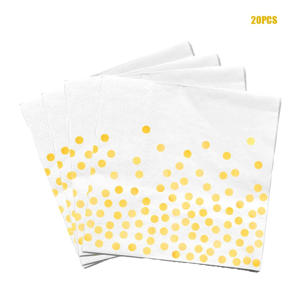 A stack of twenty white paper napkins with a gold polka dot pattern.