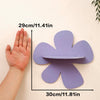 A hand is shown next to a purple cherry-shaped wooden wall shelf, measuring 29cm by 30cm.