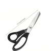 Stainless steel pinking scissors with a zig zag blade shown from the side.