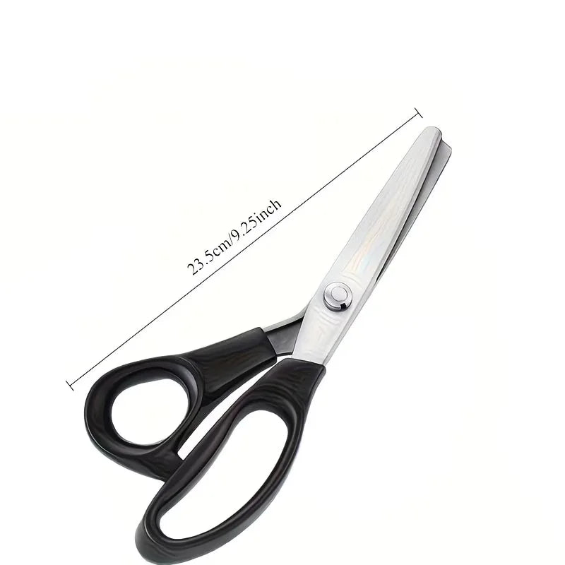 Stainless steel pinking scissors with a zig zag blade shown from the side.