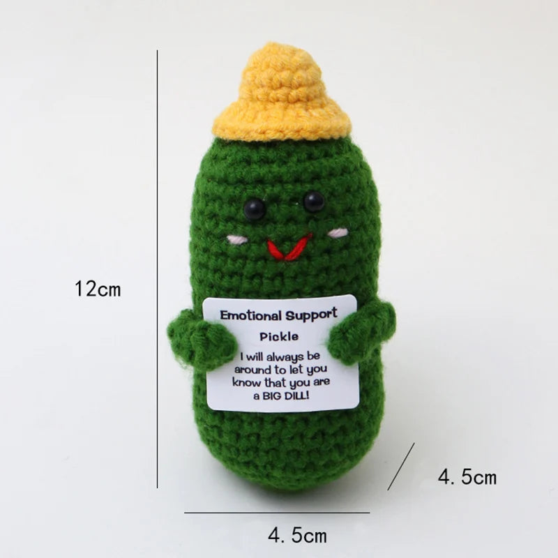 Handmade crochet potato doll with a yellow hat and a green body, featuring an inspirational card.