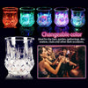 A set of five glass cups demonstrating changeable LED glow colors, including pink, blue, green, purple, and cyan.