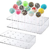 Clear acrylic display stand with multiple tiers holding colorful cake lollipops