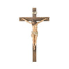 A resin figurine of the Easter Cross with a crucified figure carved in wood.