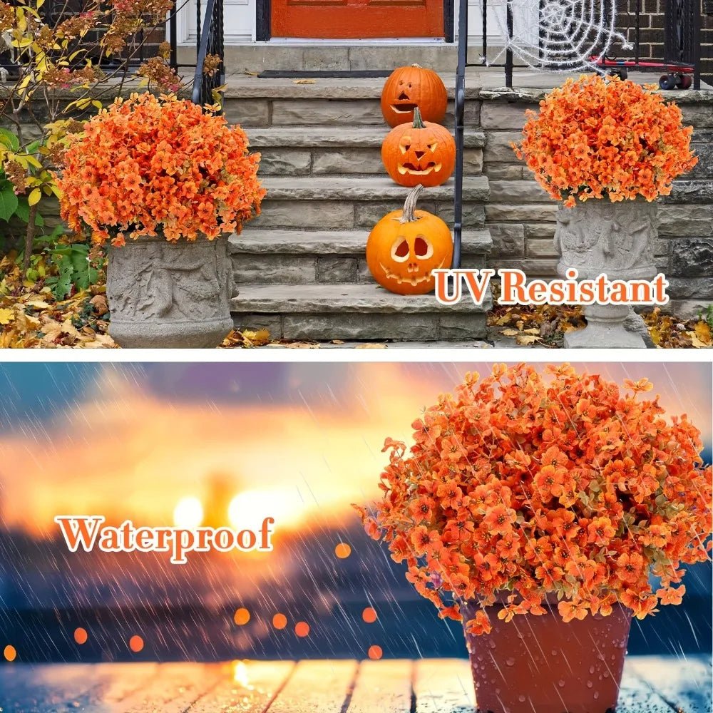 An orange artificial fall floral decor set featuring bright orange mums and carved pumpkins displayed outdoors.