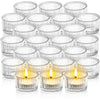 A collection of clear glass tealight candle holders and votives arranged in various sizes.