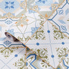 Roll of waterproof oil-proof kitchen wall sticker featuring a geometric floral pattern in blue, green, and beige tones.