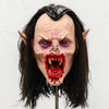 Lifelike vampire mask of a woman with pale skin, long dark hair, and bloody fangs.