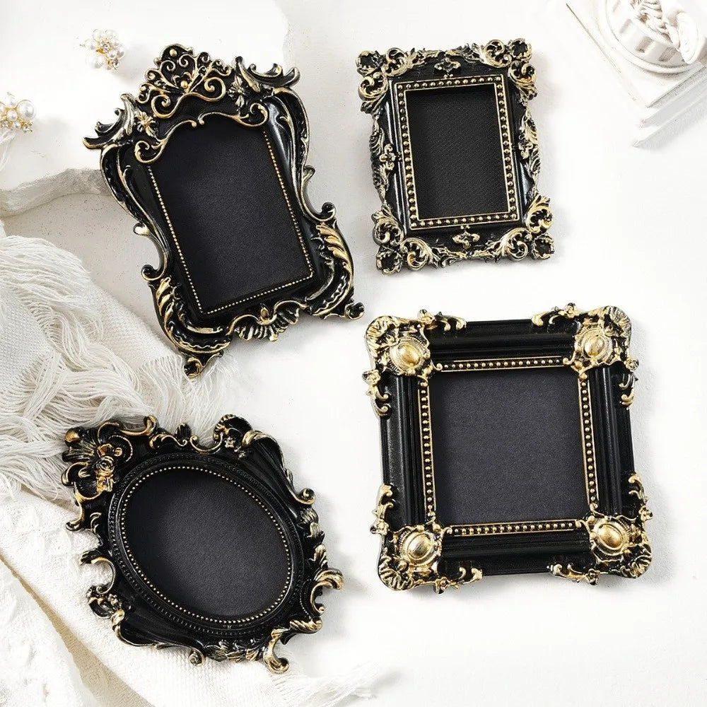 Four ornate black and gold vintage baroque resin hanging photo frames displayed on a white background.