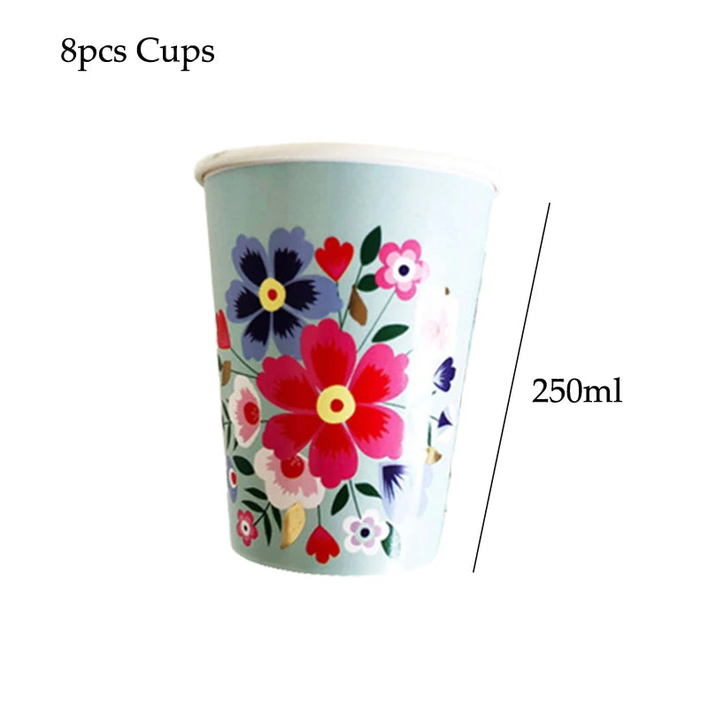 A light blue disposable cup decorated with colorful floral patterns for serving.