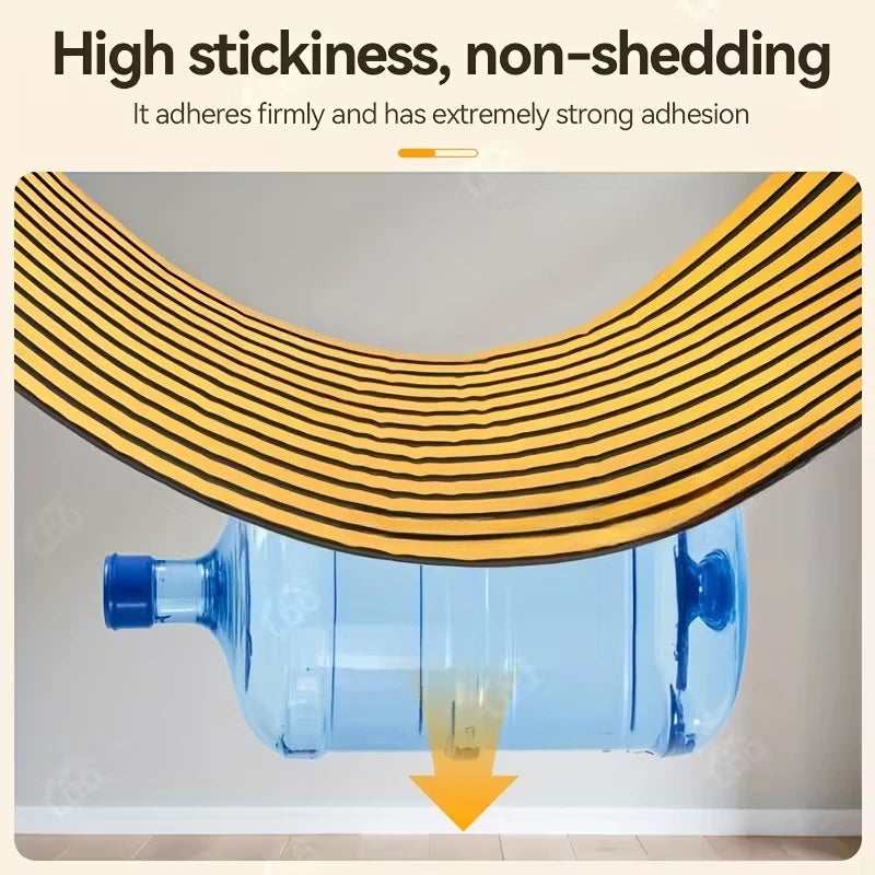 A roll of gold striped wallpaper is shown adhering firmly to a clear blue plastic bottle.