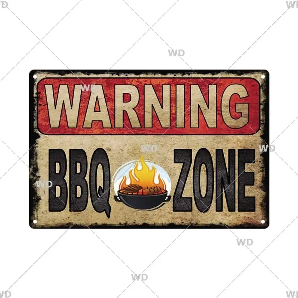 A vintage industrial tin sign with a warning label that reads WARNING BBQ ZONE.
