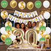 A celebration setup featuring gold and green balloons, a birthday banner, and a cake on a table.