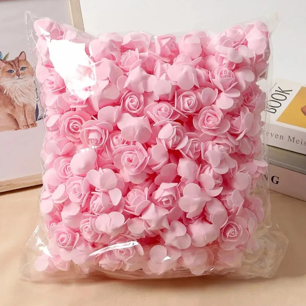 A clear plastic bag filled with pink PE foam artificial rose flowers for DIY decor.
