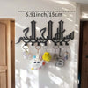 Black Islamic Arabic blessing key holder with hooks mounted on a white wall