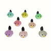 A set of seven small, colorful resin bird fairy garden decor figures in shades of green, yellow, and pink.