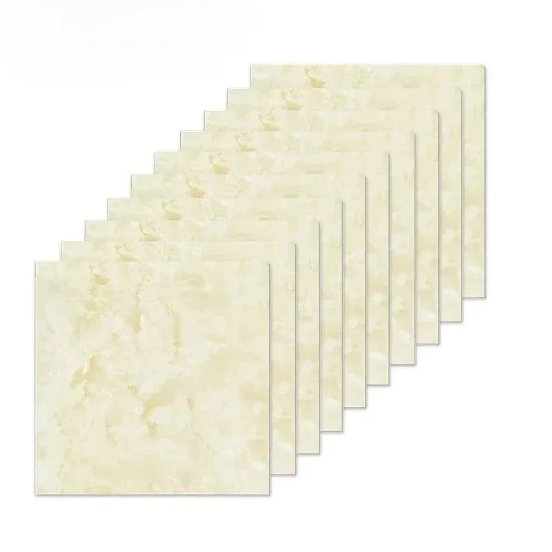 A set of rectangular 3D marble effect self-adhesive wall stickers in pale yellow and cream tones arranged in a diagonal row.