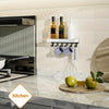 A rustic wooden floating shelf with hooks displaying bottles and a white vinegar bottle on a kitchen backsplash.