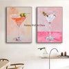 A set of two abstract paintings featuring cocktails in martini glasses with fruit garnishes.