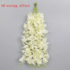 A long, cascading garland of white flowers with a 10-string effect.