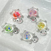 A collection of glow-in-the-dark mini sea turtle figurines with various colorful glitter fillings in a clear mold.