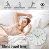 A woman is resting in bed with a modern wall clock on the bedside table, illustrating silent travel time.