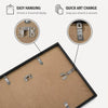 A photo display frame with aluminum hanging hardware and a quick art change mechanism.